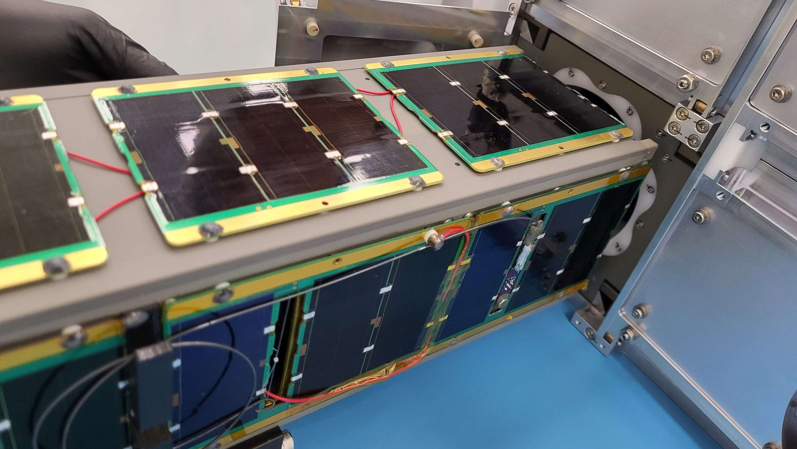 The MESAT1 CubeSat being loaded into a dispenser in the Firefly Aerospace clean room at Vandenberg Space Force Base in April 2024. Image courtesy UMaine News.